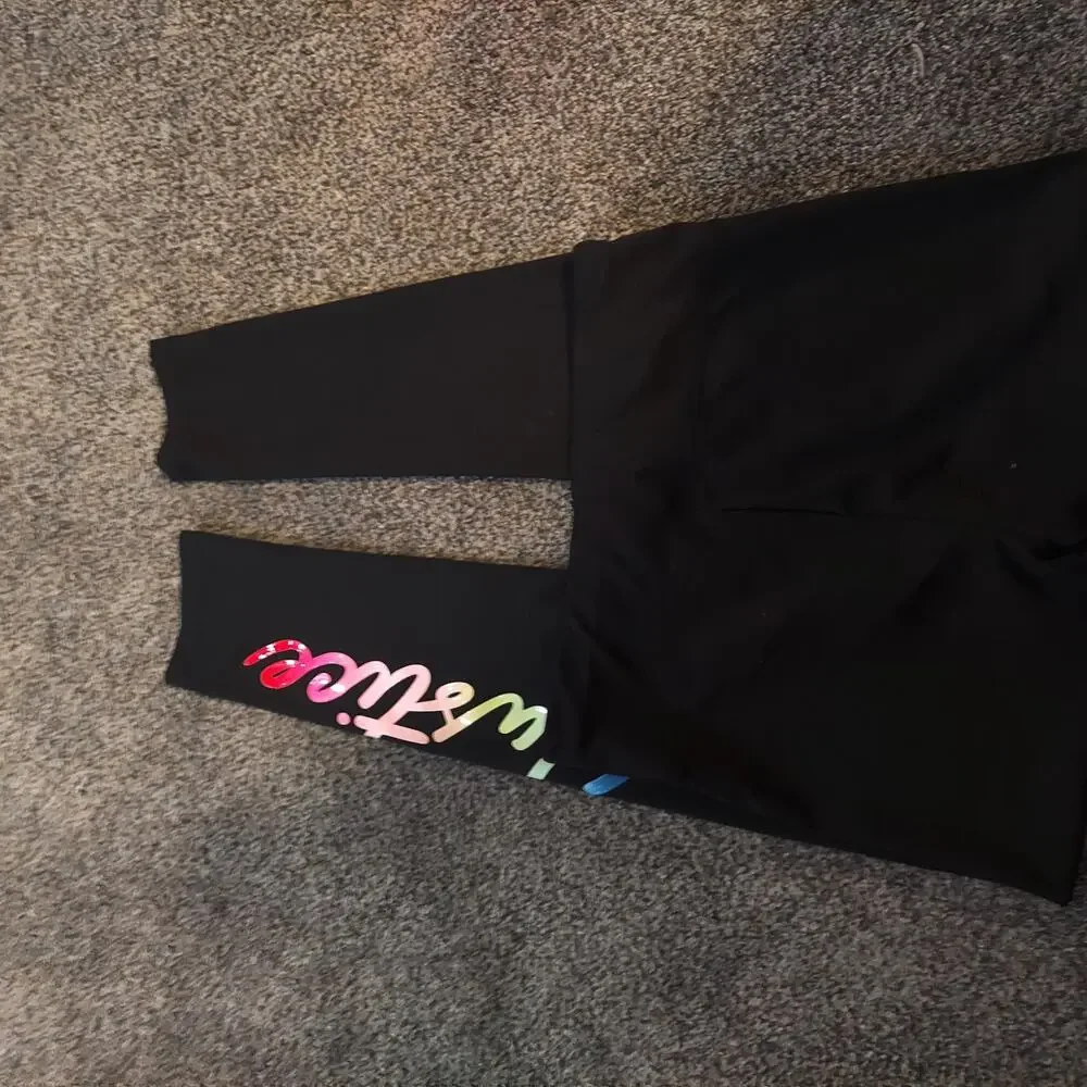 Justice black stretchy leggings Medium XL (16/18) Spell out